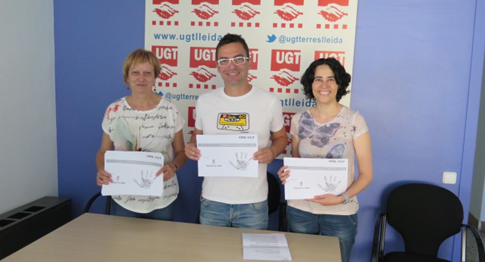 Núria Solé, David Papiol i Rosa Guixé (tècnica del servei AMIC a Lleida).